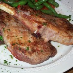 A plate of cooked pork chops. Photo courtesy of Stu Spivack. Source: http://flickr.com/photos/stuart_spivack/34677132/ This file is licensed under the Creative Commons Attribution-Share Alike 2.0 Generic license.